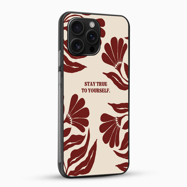 Phone case with red floral design and 'Stay True To Yourself' text on a beige background